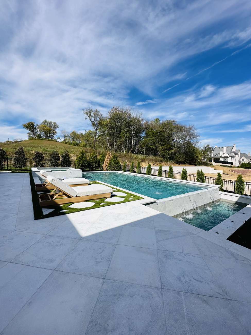 Pool deck lined with sun loungers